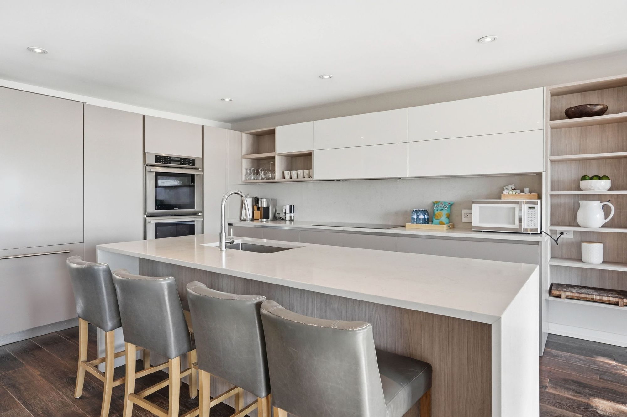The kitchen island and the long run of cabinetry
