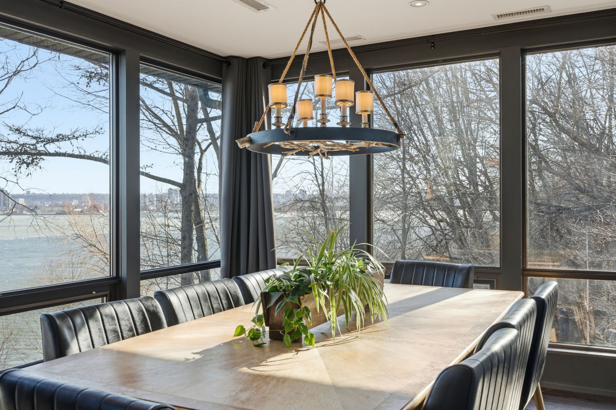 The glass-walled dining room above the bay