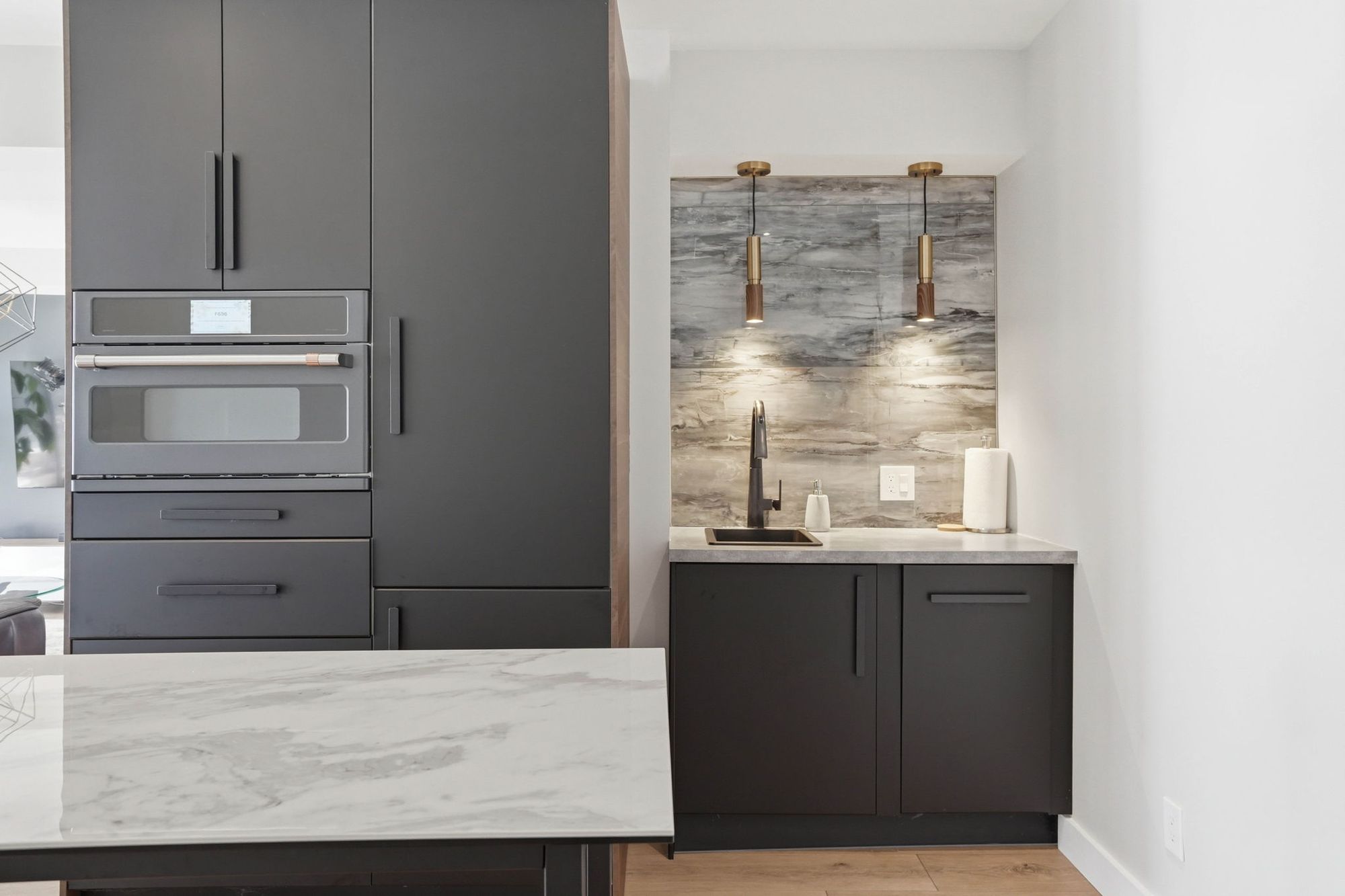The bar with its stone backsplash and pendants