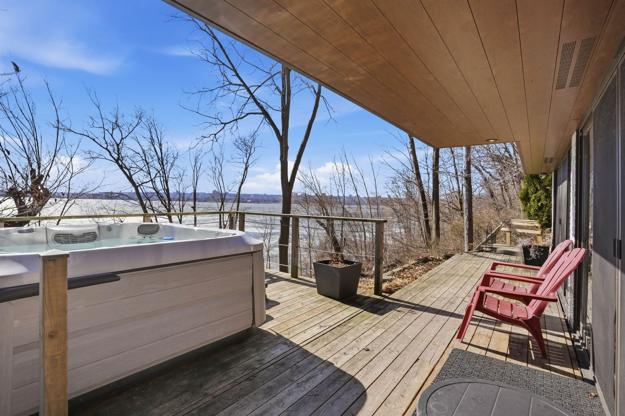 The hot tub on the lower deck facing the bay