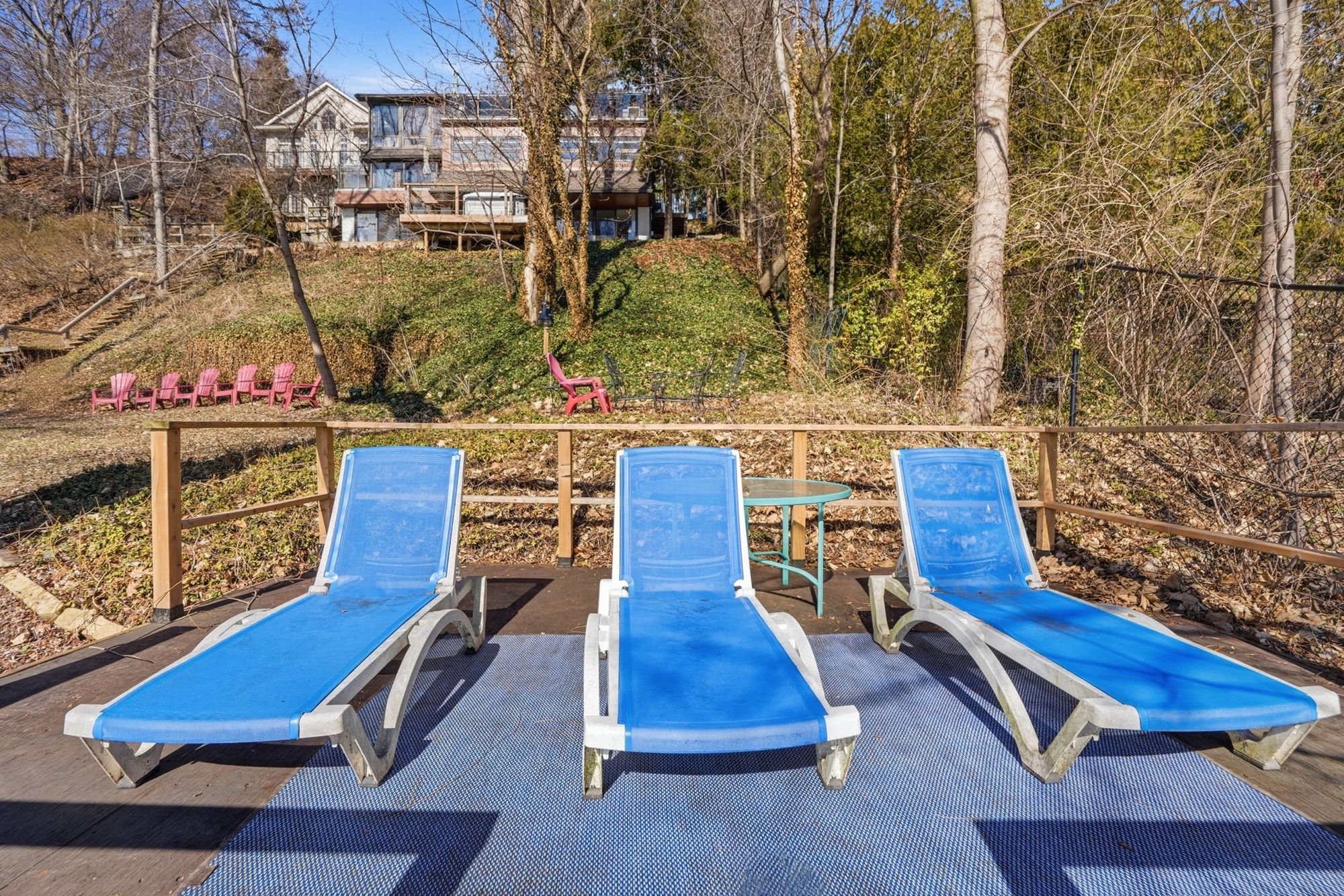 The waterside deck with its loungers at the bottom of the property