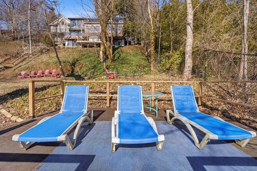 The waterside deck with its loungers at the bottom of the property